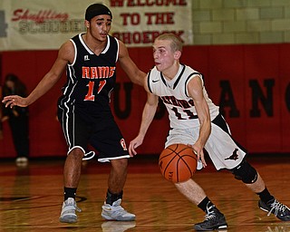 VIENNA, OHIO - DECEMBER 26, 2016: Kenny Wallace #11 of Mathews drives on Jarred Miller #10 of Mineral Ridge during the first half of their game Monday night at Mathews High School. DAVID DERMER | THE VINDICATOR