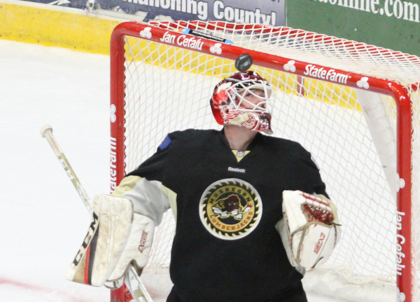 Muskegon Lumberjacks goalie Adam Brizgala (1) looks up at the puck during the first period as the Youngstown Phantoms take on the Muskegon Lumberjacks at the Covelli Centre in Youngstown on Tuesday, Dec. 27, 2016...(Nikos Frazier | The Vindicator)..