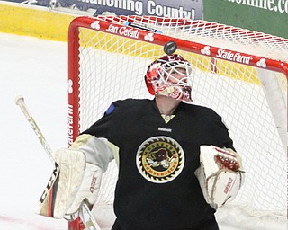 Muskegon Lumberjacks goalie Adam Brizgala (1) looks up at the puck during the first period as the Youngstown Phantoms take on the Muskegon Lumberjacks at the Covelli Centre in Youngstown on Tuesday, Dec. 27, 2016...(Nikos Frazier | The Vindicator)..