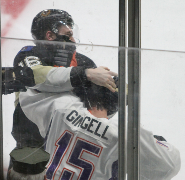 Youngstown Phantoms defense Jake Gingell (15) and Muskegon Lumberjacks forward Matt Steeves (16) battle it out during the second period as the Youngstown Phantoms take on the Muskegon Lumberjacks at the Covelli Centre in Youngstown on Tuesday, Dec. 27, 2016...(Nikos Frazier | The Vindicator)..