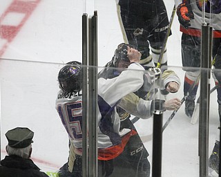 Youngstown Phantoms defense Jake Gingell (15) and Muskegon Lumberjacks forward Matt Steeves (16) battle it out during the second period as the Youngstown Phantoms take on the Muskegon Lumberjacks at the Covelli Centre in Youngstown on Tuesday, Dec. 27, 2016...(Nikos Frazier | The Vindicator)..