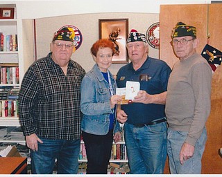 SPECIAL TO THE VINDICATOR
VFW Post 9571 of Ellsworth is closing the year by donating $500 in Giant Eagle gift cards to the Youngstown Veterans Administration Clinic Food Pantry. The post and its auxiliary support the food pantry to provide help to homeless or needy veterans. Participating in the event, from left, are Jim Tornincasa, VFW District 8 commander; Lori Stone, volunteer coordinator at Youngstown VA Clinic; Ray Schafer, quartermaster of VFW Post 9571; and Ken Calhoun, commander of the post.
