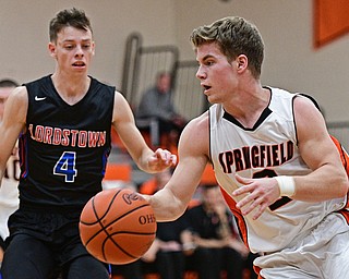 NEW Middletown, OHIO - DECEMBER 28, 2016: Frankie Centofanti #2 of Springfield drives on Garrett Behner #4 of Lordstown during the first half of their game Wednesday night at Springfield High School. DAVID DERMER | THE VINDICATOR