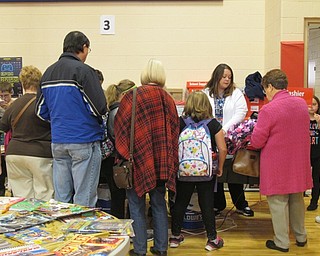 Neighbors | Alexis Bartolomucci.Guests at the Scholastic Book Fair on Nov. 15 at Austintown Intermediate School lined up to buy books.