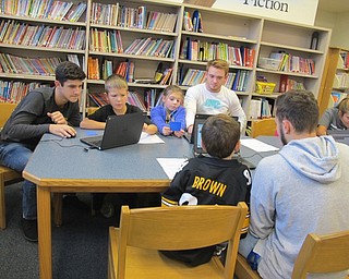 Neighbors | Alexis Bartolomucci.Poland Union second-grade students worked to make powerpoints during the AquaDogs program with Poland Seminary High School students on Nov. 17.