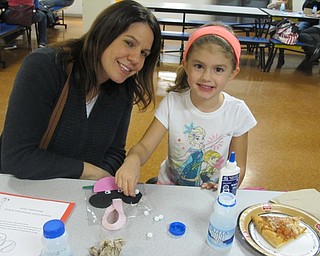 Neighbors | Alexis Bartolomucci.Angie and Ali Belinsky worked on making a Minnie Mouse craft during Poland Union's Family Disney Night on Nov. 16.