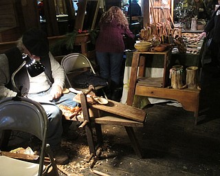 Neighbors | Alexis Bartolomucci.One of the artisans demonstrated how to carve wooden spoons during the Olde Fashioned Christmas at Lanterman's Mill on Nov. 26.