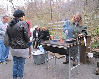 Neighbors | Alexis Bartolomucci.Guests lined up to try roasted chestnuts at the Lanterman's Mill Olde Fashioned Christmas event on Nov. 26.