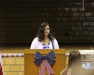 Neighbors | Abby Slanker.A Canfield Village Middle School student explained the significance of the inverted glass on The White Table during the school’s annual Veterans Day program on Nov. 11.