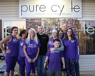 Neighbors | Abby Slanker.Instructors and riders participated in the third annual Turn It Purple Ride at Pure Cycle Spinning Studio to raise awareness of pancreatic cancer and funds for research on Nov. 18.