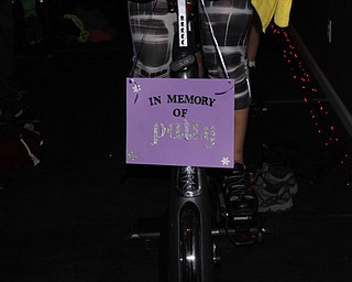 Neighbors | Abby Slanker.Several riders at the third annual Turn It Purple Ride at Pure Cycle Spinning Studio made signs and dedicated their rides in memory of people they knew who were diagnosed with pancreatic cancer.