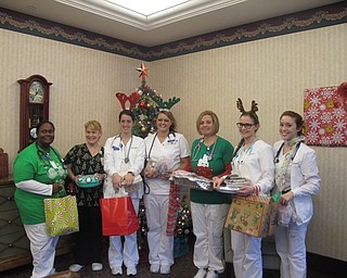 Neighbors | Alexis Bartolomucci.Nursing students and their instructor from Kent State University East Liverpool brought in treats for the faculty and residents at Assumption Village in Boardman to celebrate the end of their clinicals. Pictured are, from left, Tanisha Kirk, Nursing Instructor Angela Douglass, Courtney Hall, Erica Snoddy, Amy Gabriel, Jami Watson and Danielle Rollison.