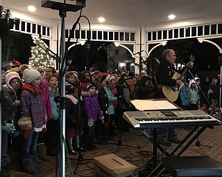 Neighbors | Alexis Bartolomucci.Second-grade students from Poland Union were led by music instructor Dean Wilson and sang at the Lighting of the Village on Dec. 3.