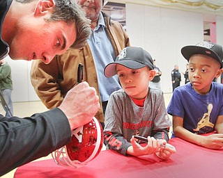 William D. Lewis The Vindicator  YSU football player Zak Kennedy signs an autograph for Caden Hernandez and Jalen Carter, both 6 and from Austintown during a meet the team session before YSU mens basketball game Thursday 12-29-16 at YSU.