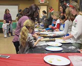Neighbors | Alexis Bartolomucci.Children rolled out their cookie dough to bake and decoration during the Cookies with Santa event at Boardman Park on Dec. 21.