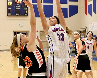 Western Reserve's Gabbi Baranowski (23) goes up for a shot while being closely defended by Springfield's Mariah Johnson (23) during the first quarter of Thursday nights matchup at Western Reserve High School in Berlin Center.  Dustin Livesay  |  The Vindicator  12/29/16 Wester Reserve High School.
