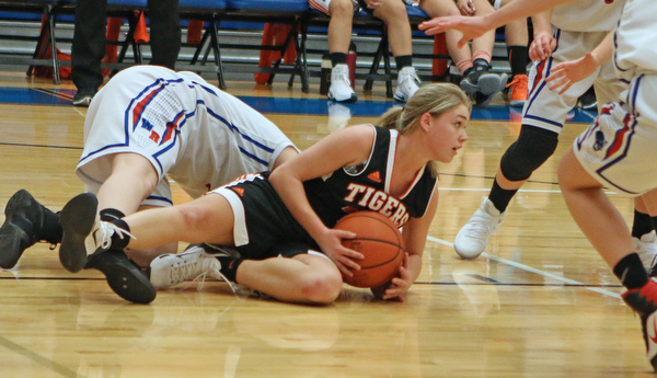 Springfield's Makenzy Capouellez (4) secures a loose ball during the third quarter of Thursday nights matchup against Western Reserve High School at Western Reserve High School in Berlin Center.  Dustin Livesay  |  The Vindicator  12/29/16 Wester Reserve High School.