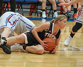 Springfield's Makenzy Capouellez (4) secures a loose ball during the third quarter of Thursday nights matchup against Western Reserve High School at Western Reserve High School in Berlin Center.  Dustin Livesay  |  The Vindicator  12/29/16 Wester Reserve High School.