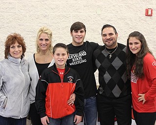 Neighbors | Abby Slanker.Canfield High School senior wrestler Georgio Poullas celebrated with his family at his letter of intent signing ceremony as he signed his NCAA national letter of intent as he formally committed to Cleveland State University Dec. 2. Pictured are, left to right, Barb Applegate, Tammy Poullas, Niko Poullas, Georgio Poullas, George Poullas and Athena Poullas.