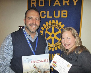 SPECIAL TO THE VINDICATOR
Elaine Maro, right, executive director of Access Health Mahoning Valley, was the speaker at the last meeting of Rotary Club of Austintown in 2016. She works in Warren and has an office in the Oakhill Renaissance building in Youngstown. The organization assists residents in getting care from physicians, dentists and vision care providers. Call her in Warren at 330-373-0703 or in Youngstown at 330-746-5424. Ed Kalaher, Austintown Rotary president, presented Maro with a book to commemorate the event and it will be donated to Austintown Elementary School library.


