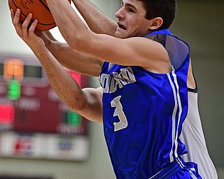 STRUTHERS, OHIO - DECEMBER 30, 2016: Braeden O'Shaungnessy #3 of Poland grabs a rebound away from AJ Musolino #10 of Struthers during the second half of their game Friday night at Struthers High School. DAVID DERMER | THE VINDICATOR
