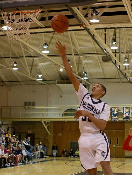 Braedon Poole (30) puts up an uncontested layup during the third quarter of Friday nights matchup against Niles High School at McDonald High School.  Dustin Livesay  |  The Vindicator  12/30/16  McDonald.