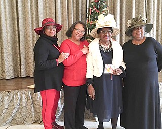SPECIAL TO THE VINDICATOR
Angela Pickett, second from left, president of Youngstown Section of National Council of Negro Women, congratulates winners of the “Hat Parade” featured at the “Hats Off to Seniors” event that the section hosted at McGuffey Centre. From left are Sally Hawkins, third-place winner; Ida Mae Morris, first place; and Juanita Rodgers, second.