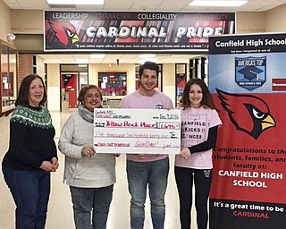 SPECIAL TO THE VINDICATOR
Jad Saleh, second from right, and Cecilia Shaer, right, senior varsity soccer players at Canfield High School, present an oversize check to Marlene Mikan, left, a volunteer at Yellow Brick Place, and Donna Detwiler, one of the founders of Yellow Brick Place. For their senior National Honor Society project, students sponsored Pink-Out soccer games in October to raise funds for Yellow Brick Place and Joanie Abdu Comprehensive Breast Care Center. YBP supports and educates cancer patients and those closest to them by providing individual and group services in Mahoning, Trumbull and Columbiana counties. Money was divided between the two organizations with YBP receiving $1,600. Below, members of the Ladies Auxiliary of Austintown Eagles sponsored a craft show, basket raffle and bake sale with funds earmarked for Yellow Brick Place. Lynette Marshall and Marylou Dawson were co-chairwomen. The auxiliary donated more than $1,160 to YBP.