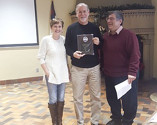 SPECIAL TO THE VINDICATOR
Kiwanis Club of Youngstown named Jerry Osborne, Kiwanian of the Year, during the club’s Dec. 16 meeting. He is a retired banking executive and has been a member of Youngstown Kiwanis since 2002. He has served as club president and district lieutenant governor. He is presently the club treasurer. Carla Hunter, left, club president, and Anthony D’Apolito, right, past president, presented Osborne with a plaque for his years of service. For information on the club, call Chris McCarty at 330-729-1017 or 310-948-8858.