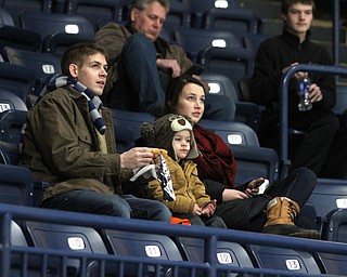 (from left) Thomas, Gabriel(3) and Rachel Clunen of Girard enjoy some snacks before ice skating during First Night Youngstown at the the Covelli Centre in Youngstown on Saturday, Dec. 31, 2016...(Nikos Frazier | The Vindicator)..