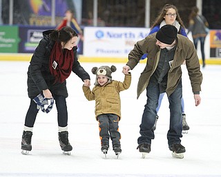 (from left) Thomas and Rachel Clunen of Girard help their son, Gabriel(3) ice skate during First Night Youngstown at the the Covelli Centre in Youngstown on Saturday, Dec. 31, 2016...(Nikos Frazier | The Vindicator)..