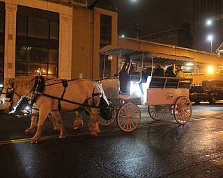 Horse drawn carriage around federal plaza during First Night Youngstown in Youngstown on Saturday, Dec. 31, 2016...(Nikos Frazier | The Vindicator)..