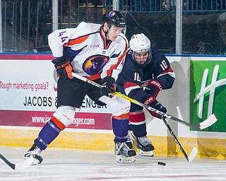 Youngstown Phantoms forward Coale Norris (44) checks USA NTDP forward Scott Reddy (10) in to the boards during the second period at the Covelli Centre on December 31, 2016. The Phantoms won 3-1.