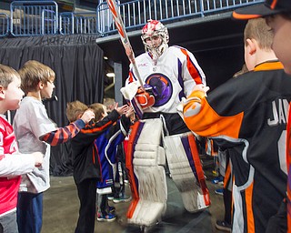 Youngstown Phantoms goalie Ivan Kulbakov (31) high fives fans as he walks to the ice for the third period against USA NTDP at the Covelli Centre on December 31, 2016. The Phantoms won 3-1.