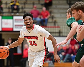 YOUNGSTOWN, OHIO - DECEMBER 31, 2016: Cameron Morse #24 of YSU shouts to a teammate while dribbling into the pain during the first half of their game Saturday afternoon at Beeghly Center. DAVID DERMER | THE VINDICATOR