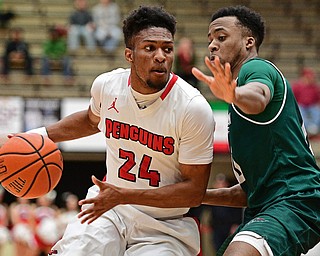 YOUNGSTOWN, OHIO - DECEMBER 31, 2016: Cameron Morse #24 of YSU drives on Warren Jones #0 of Green Bay during the first half of their game Saturday afternoon at Beeghly Center. DAVID DERMER | THE VINDICATOR