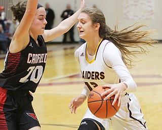  William D. Lewis The vindicatorSouth Range's Maddie Durkin(13) drives around Canfield's Alexandra Stanic(20)  during 1-2-17 action at South Range.