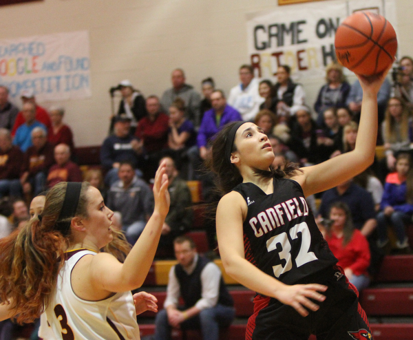  William D. Lewis The vindicator Canfield's Christine Rivera(32) shoots past South Range's Kate Yeagley (3) during 1-2-17 action at South Range.