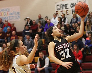 William D. Lewis The vindicator Canfield's Christine Rivera(32) shoots past South Range's Kate Yeagley (3) during 1-2-17 action at South Range.