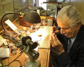 William D. Lewis The Vindicator   Longtime downtown watch repairman Nicholas Yurchyk at work in his Federal St shop 12302016