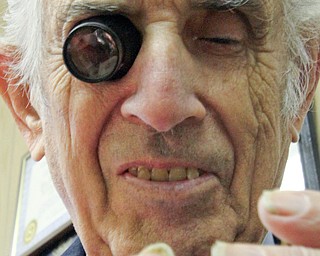 William D. Lewis The Vindicator   Longtime downtown watch repairman Nicholas Yurchyk at work in his Federal St shop 12302016