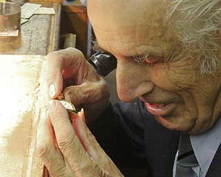 William D. Lewis The Vindicator   Longtime downtown watch repairman Nicholas Yurchyk at work in his Federal St shop 12302016