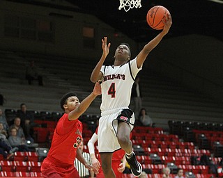 Struthers forward Ja'Juan Douglas(4) goes for the layup against Edgewood Ricky Baldwin(33)during the first quarter as The Struthers Wildcats takes on the Edgewood Warriors at the Struthers High School Fieldhouse in Struthers on Tuesday, Jan. 3, 2017. Struthers won, 55-45...(Nikos Frazier | The Vindicator)..
