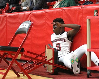 Struthers guard Kevin Traylor(3) lands in the benches after diving to save a wild pass during the first quarter as The Struthers Wildcats takes on the Edgewood Warriors at the Struthers High School Fieldhouse in Struthers on Tuesday, Jan. 3, 2017. Struthers won, 55-45...(Nikos Frazier | The Vindicator)..