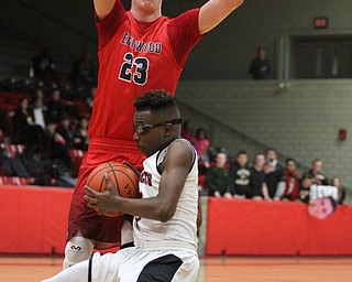 Struthers guard Kevin Traylor (3) slips after charging at Edgewood Marcus Ernst (23) during the first quarter as The Struthers Wildcats takes on the Edgewood Warriors at the Struthers High School Fieldhouse in Struthers on Tuesday, Jan. 3, 2017. Struthers won, 55-45...(Nikos Frazier | The Vindicator)..
