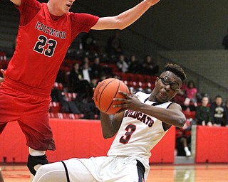 Struthers guard Kevin Traylor (3) slips after charging at Edgewood Marcus Ernst (23) during the first quarter as The Struthers Wildcats takes on the Edgewood Warriors at the Struthers High School Fieldhouse in Struthers on Tuesday, Jan. 3, 2017. Struthers won, 55-45...(Nikos Frazier | The Vindicator)..