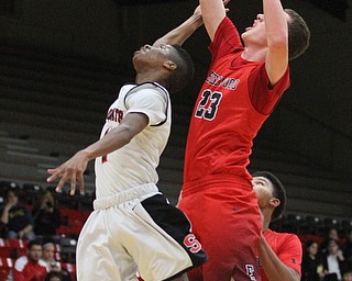 Edgewood Marcus Ernst (23) snatches the rebound from Struthers forward Ja'Juan Douglas(4) during the first quarter as The Struthers Wildcats takes on the Edgewood Warriors at the Struthers High School Field house in Struthers on Tuesday, Jan. 3, 2017. Struthers won, 55-45...(Nikos Frazier | The Vindicator)..