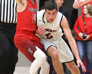 Struthers guard Andrew Carbon(5) tries to push back Edgewood Dalton Dragon(11) during the first quarter as The Struthers Wildcats takes on the Edgewood Warriors at the Struthers High School Fieldhouse in Struthers on Tuesday, Jan. 3, 2017. Struthers won, 55-45...(Nikos Frazier | The Vindicator)..