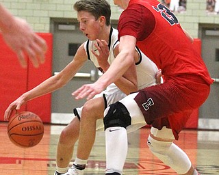 Struthers guard Carson Ryan(2) rolls off Edgewood Marcus Ernst(23) the second quarter as The Struthers Wildcats takes on the Edgewood Warriors at the Struthers High School Fieldhouse in Struthers on Tuesday, Jan. 3, 2017. Struthers won, 55-45...(Nikos Frazier | The Vindicator)..