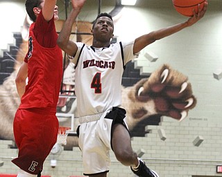 Struthers forward Ja'Juan Douglas(4) goes up for the layup against Edgewood Marcus Ernst(23) during the third quarter as The Struthers Wildcats takes on the Edgewood Warriors at the Struthers High School Fieldhouse in Struthers on Tuesday, Jan. 3, 2017. Struthers won, 55-45...(Nikos Frazier | The Vindicator)..